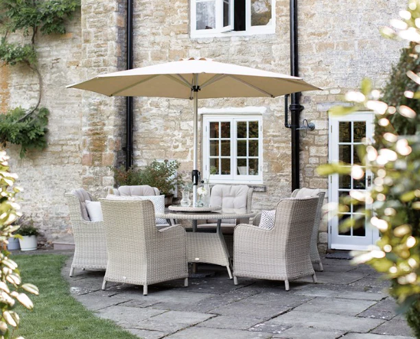 Chedworth Sandstone Rattan 6 Seat Round Dining Set with Lazy Susan, Parasol & Base